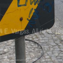 black and yellow metal street sign, street, sidewalk, urban, city, cables on the ground, day, sunlight, outdoors, day